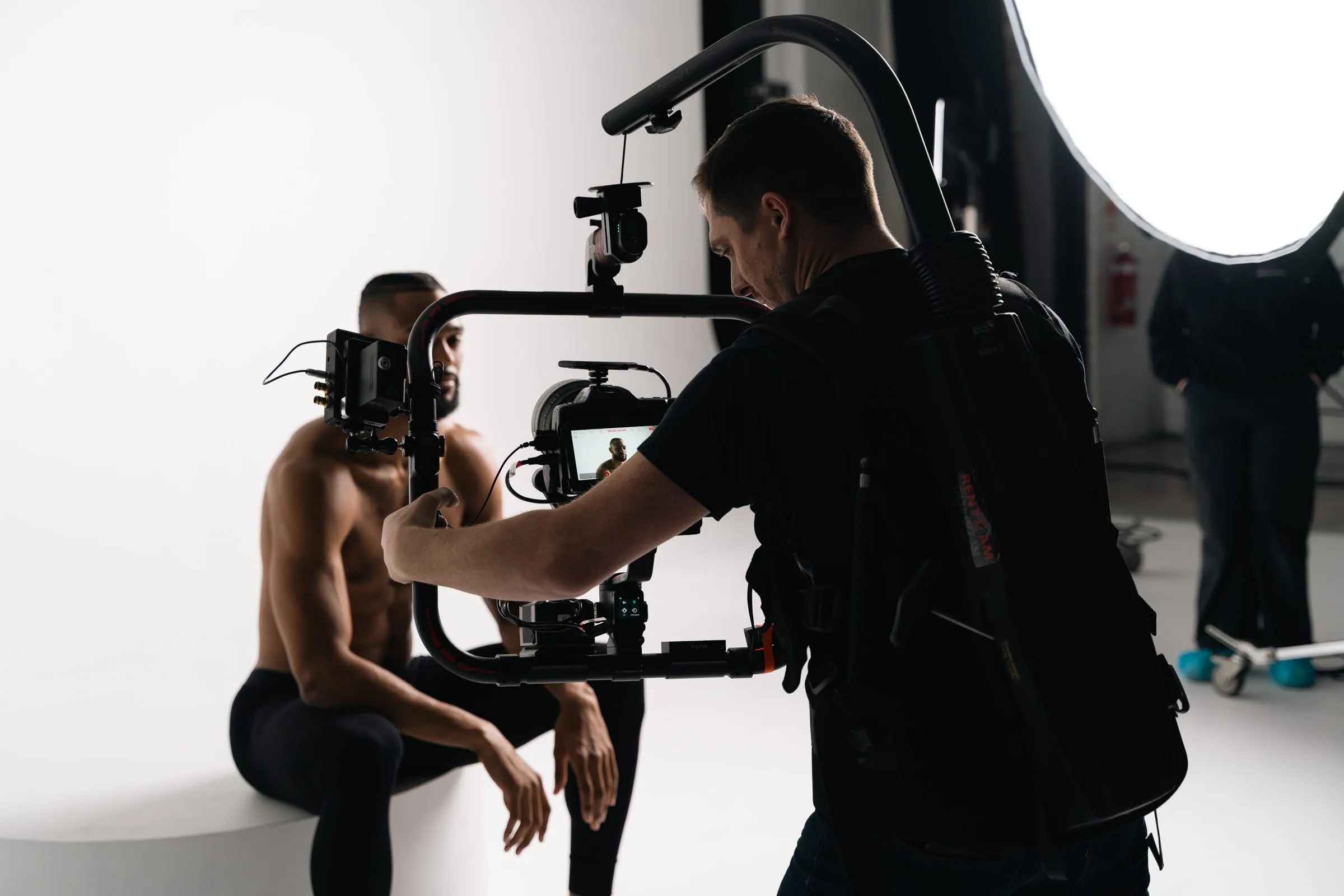 Matthew filming on a gimbal rig during a studio shoot